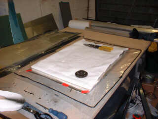 Bagging film and tack tape in place
